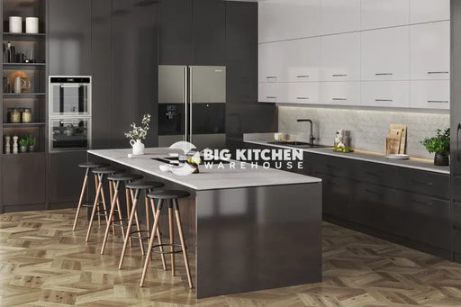 Modern kitchen with dark cabinets, a large gray island and black stools, built-in appliances, herringbone light wood floor, and minimalist decor. Vis Oya Square Edge Laminate Kitchen Worktops add a sleek touch to open shelves displaying plants and kitchenware.